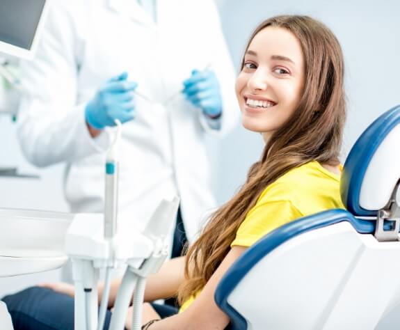 Smiling woman in dental chair