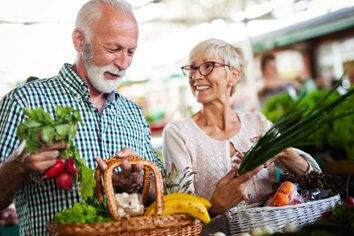 Seniors buying healthy foods to eat