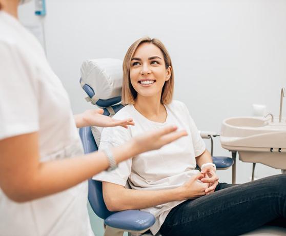 Lady smiles at dentist