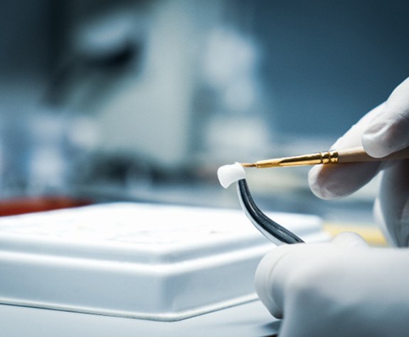 dental technician working on dental crown 