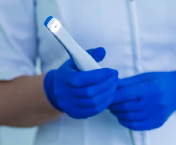 Dentist holding an intraoral camera