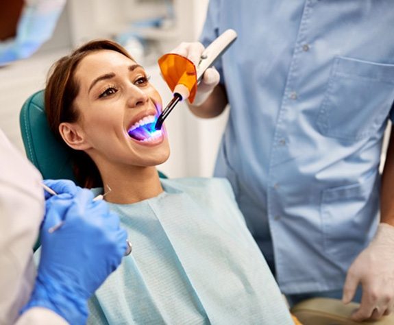 a patient receiving a tooth colored filling