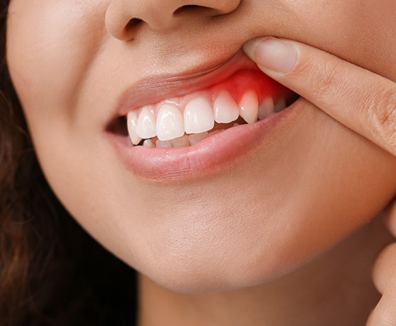 Senior woman standing in dentist’s office smiling