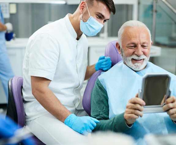 Man during dental checkup in Raleigh 