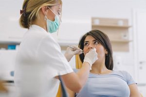  a patient visiting her dentist for preventive care