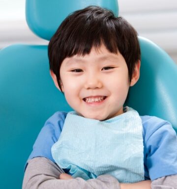 Young dental patient smiling during visit to see the children's dentist