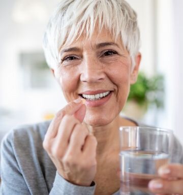 Woman smiling after T M J treatment