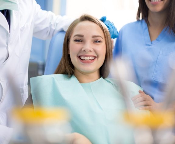 Woman smiling during dental office visit